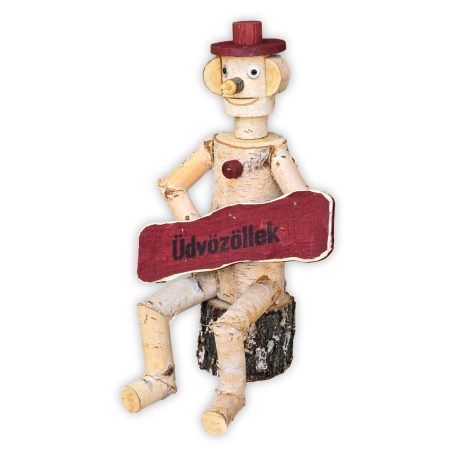Holzfigur mit "Üdvözöllek"-Schild
